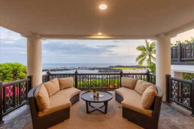 Twilight oceanfront lanai overlooking the Pacific in Kona Bay Estates